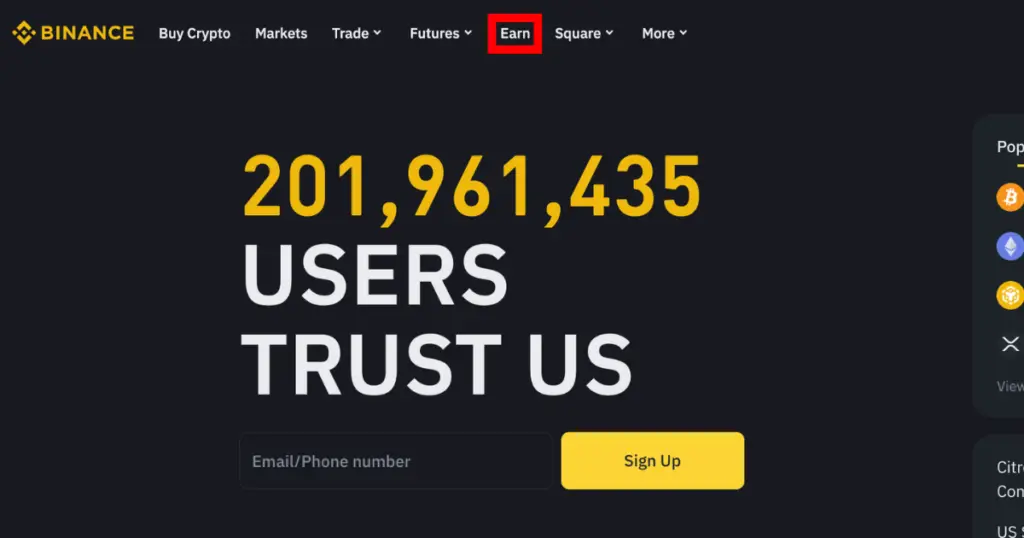 Red square pointing to Earn button on Binance